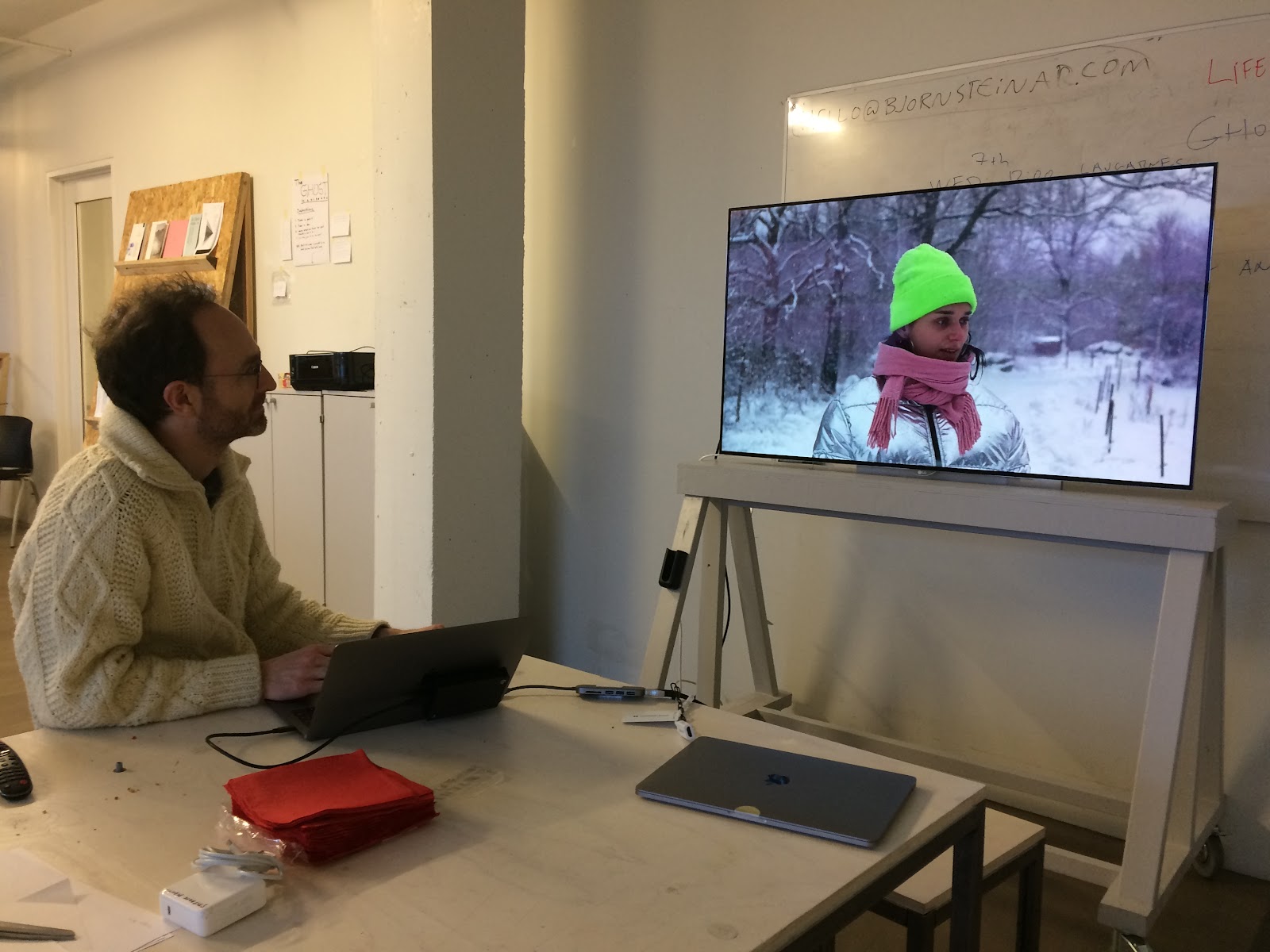 My colleague Stephane Degoutin looking at a screen in a classroom: on the screen: A pic of me
