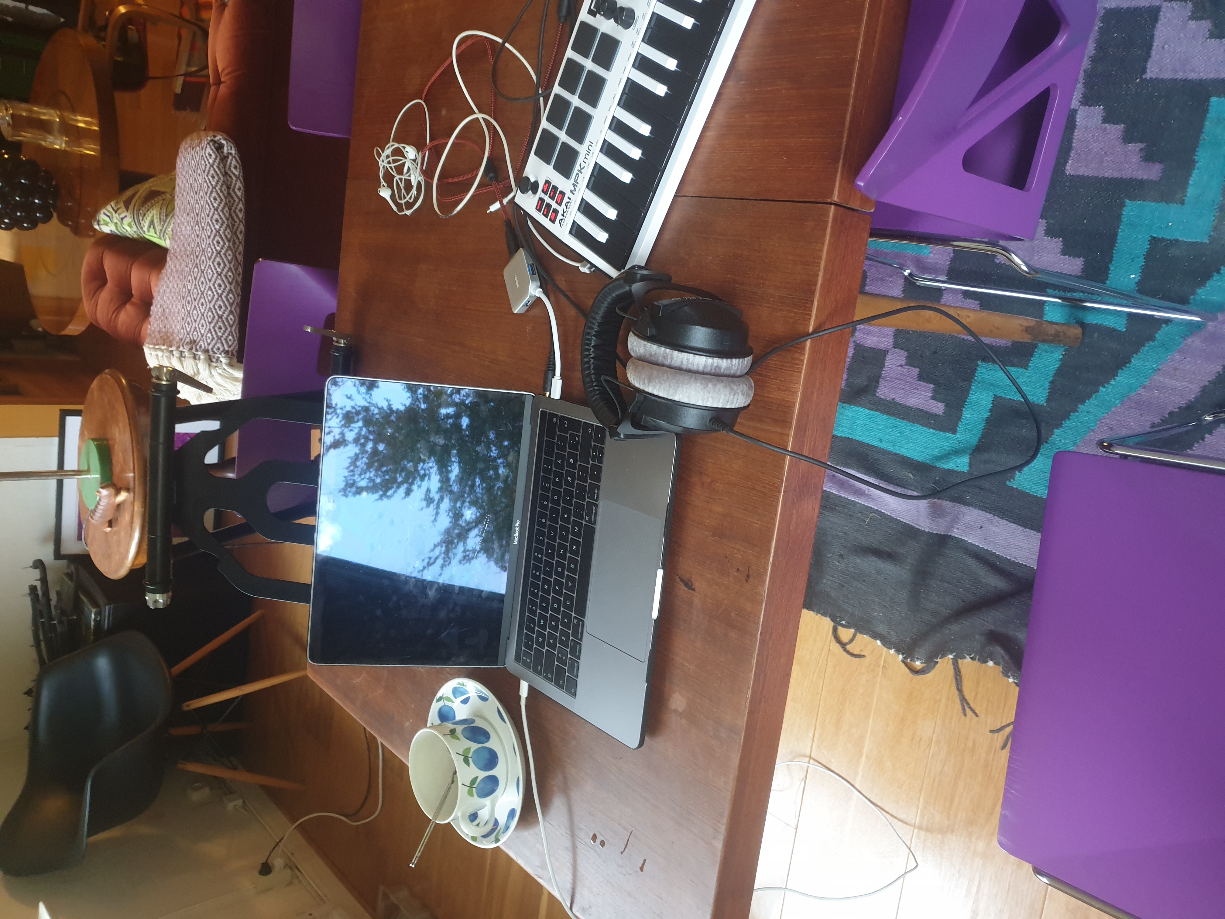 A dining table with computer and midi keyboard